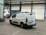 a white van that is parked in a parking lot