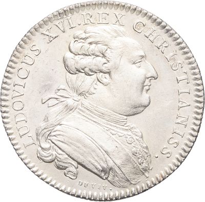 une pièce d'argent représentant le portrait d'un homme de profil
