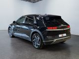 the rear of a black volkswagen e - trac suv parked in a garage