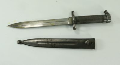 two knives are laying next to each other on a white surface