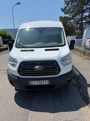a white van that is parked on the side of the road