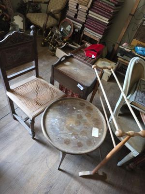 a chair and a table in a room with a lot of furniture