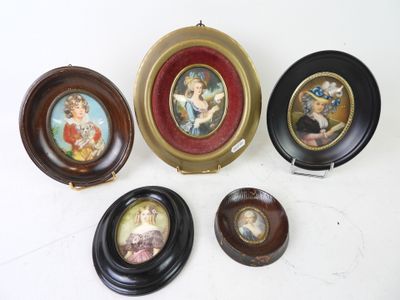 four miniature plates with pictures of people on them sitting on a table
