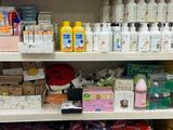 a lot of cleaning products on the shelves in the store