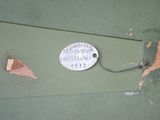 a piece of paper that has been torn off and a tag on it