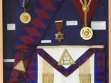an image of a framed picture of a masonic sash and medals