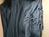 a cardboard box with a bunch of clothes inside of it
