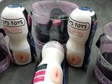 five bottles of toothpaste and a cup of toothpaste on the counter