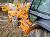 a tractor that is parked on the side of the road