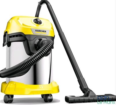 a yellow and black vacuum cleaner with a black hose