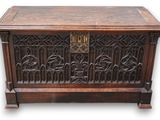 an old wooden chest with ornate carvings on it