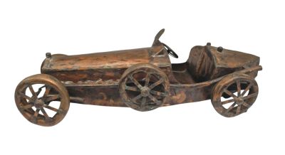 a wooden toy car with wheels on a white background