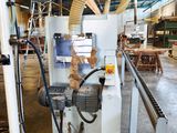 a machine that is working on a piece of wood