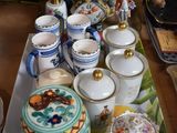 a tray with a tray of tea cups and saucers on it