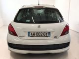 a white car that is parked in a white room