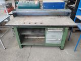a workbench that is sitting in the middle of the floor