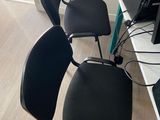 three chairs that are sitting in front of a tv