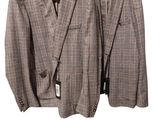 two jackets hanging on a hanger on a white background