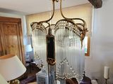 a chandelier hanging from the ceiling in a living room