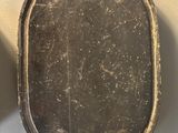 pair of antique cast iron frying pans on a white background