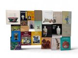 many books that are stacked on top of each other