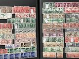 many different types of stamps on display in a black case