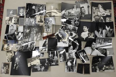 several black and white photos of people and their families on a wall