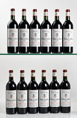 several bottles of wine are lined up on a glass shelf
