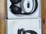 an image of a pair of headphones sitting on top of a wooden table