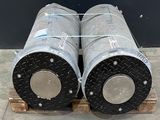 two metal pipes sitting on a pallet on a pallet
