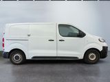 a picture of a white van parked in a garage