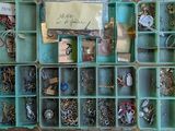 many different types of jewelry in this box