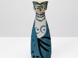 a small blue vase with a black and white design on it