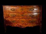 an image of a chest of drawers against a black background