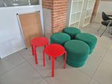 three stools and a table in a room