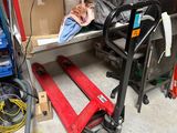 many boxes and tools in the garage on the shelf