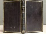 a black book that is open on a table