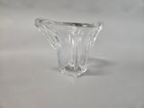 a glass vase that is sitting on a table