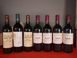 six bottles of wine are lined up on a red table