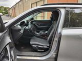 a car door open with the driver ' s seat up