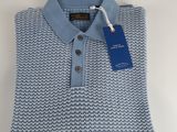 a blue and white polo shirt with a tag on it