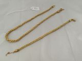 a gold chain with a clasp and a clasp on a white background
