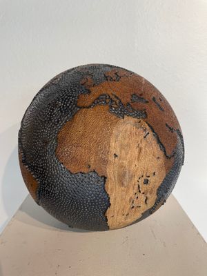 a basketball ball with a map of the world painted on it