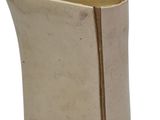 an old book with a gold cover on a white background