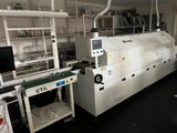 an image of a machine in a factory with a lot of shelves