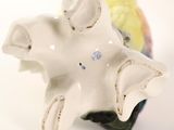 porcelain figurine of an elephant with a flower on its head
