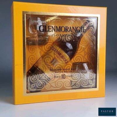 the box contains a variety of items that include a bottle of wine and a glass of wine