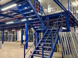 an image of a large warehouse with a lot of stairs