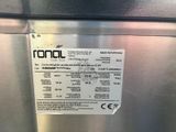 a label on the side of a stainless steel refrigerator
