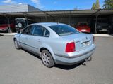 a silver car that is parked in a parking lot